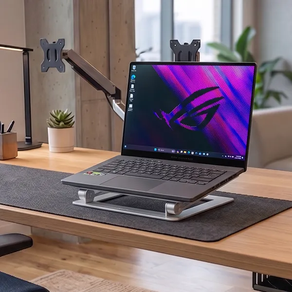 ASUS ROG Zephyrus G14 gaming laptop on a desk in an office background