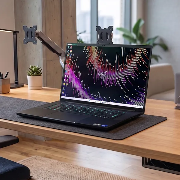 Razer Blade 18 gaming laptop on a desk in a modern office setting